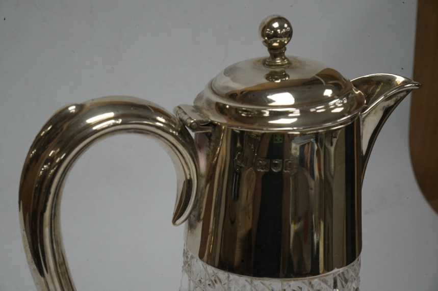 A George V silver mounted cut glass claret jug, Birmingham, 1911, height 25.3cm, Condition - poor to fair